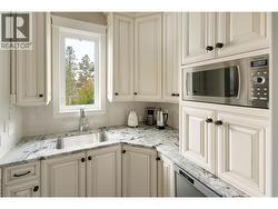 butler pantry with second dishwasher and sink -