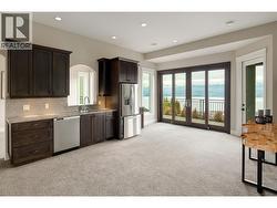 downstairs kitchenette with 3rd dishwasher and full size fridge -