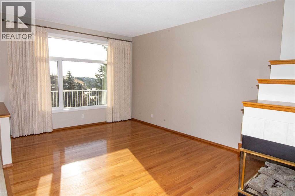 Living Room - 16 Eagleview Heights Nw, Cochrane, AB - Indoor Photo Showing Other Room