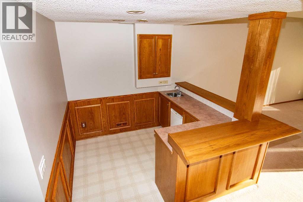 16 Eagleview Heights Nw, Cochrane, AB - Indoor Photo Showing Other Room