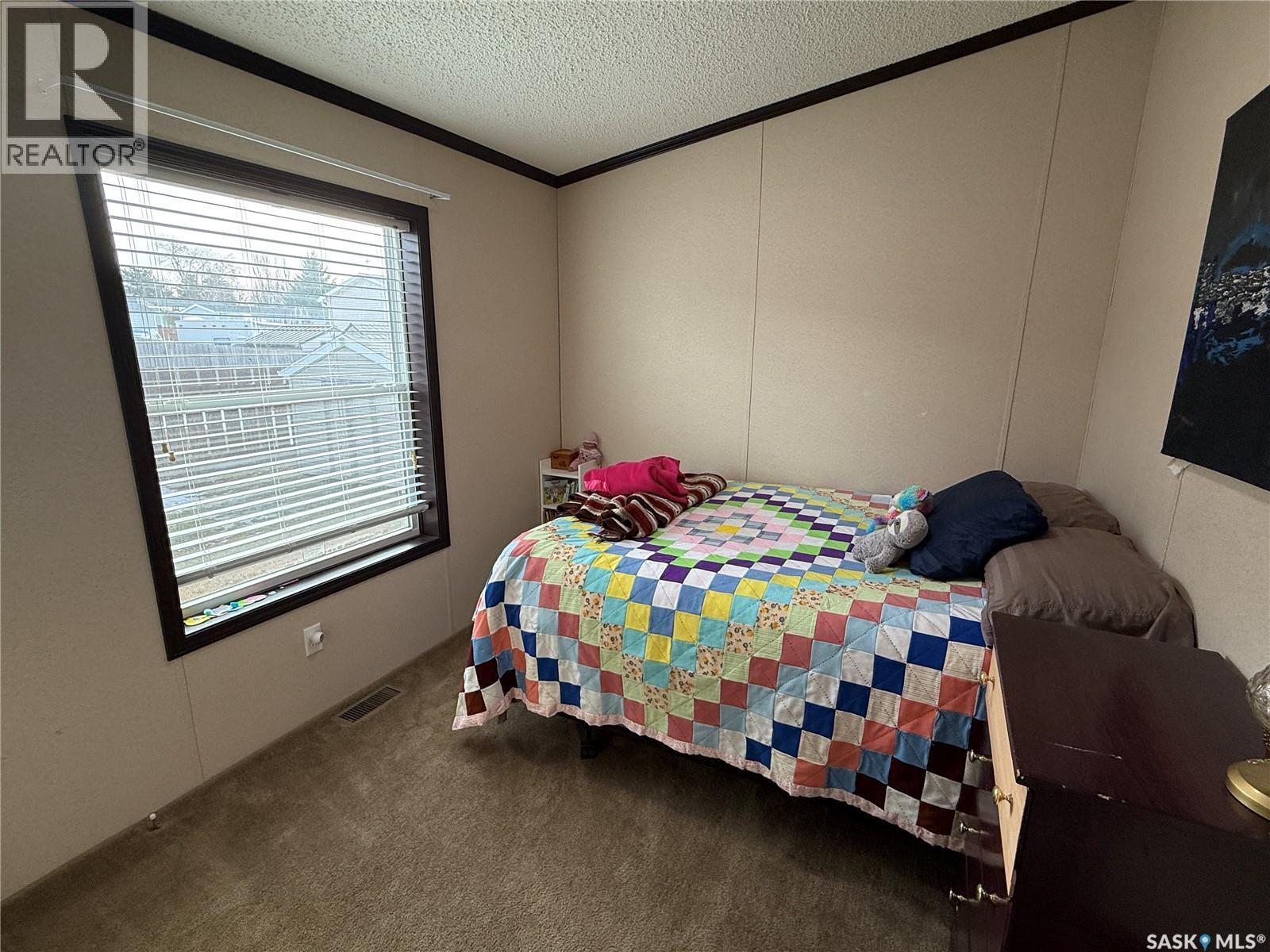 4 7Th Avenue Se, Weyburn, SK - Indoor Photo Showing Bedroom