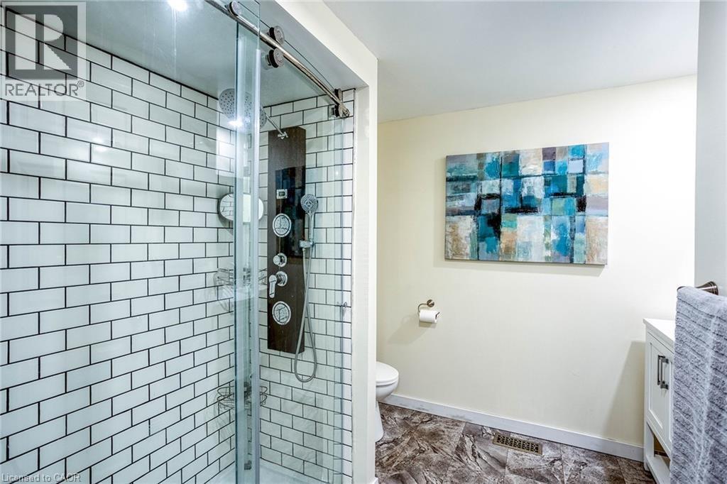 Full bath with vanity and a stall shower - 310 Magnolia Drive, Hamilton, ON - Indoor Photo Showing Bathroom