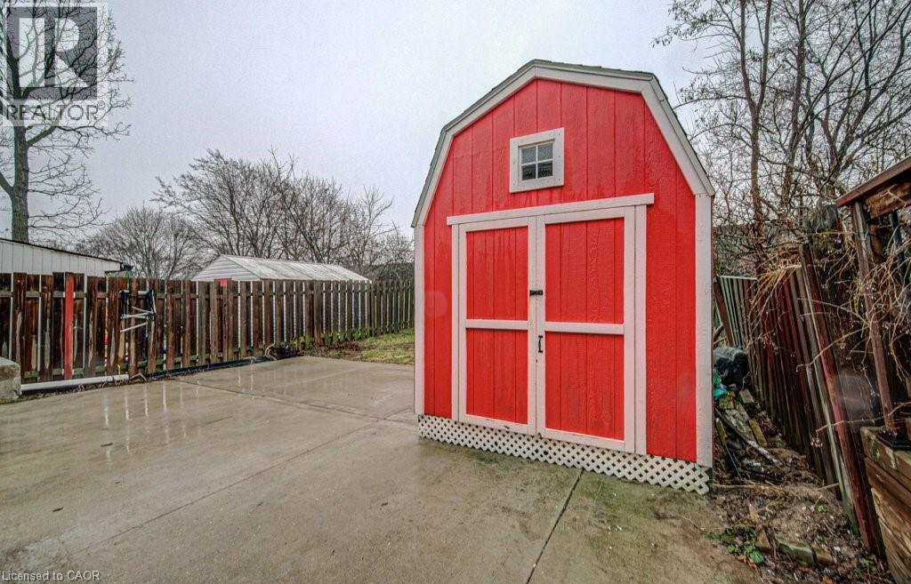 View of shed with a fenced backyard - 310 Magnolia Drive, Hamilton, ON