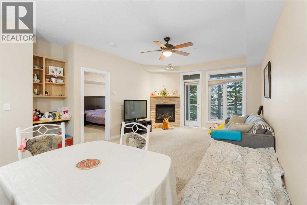 8103, 14 Hemlock Crescent Sw, Calgary, AB - Indoor With Fireplace