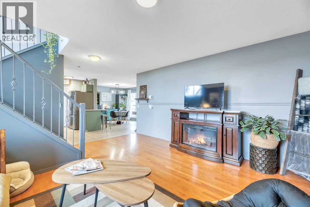 512 Highland Close, Strathmore, AB - Indoor Photo Showing Living Room With Fireplace