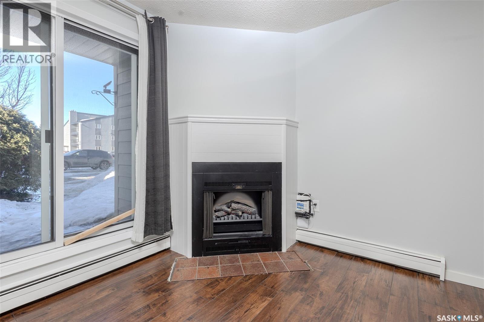 112 203 Tait Place, Saskatoon, SK - Indoor With Fireplace