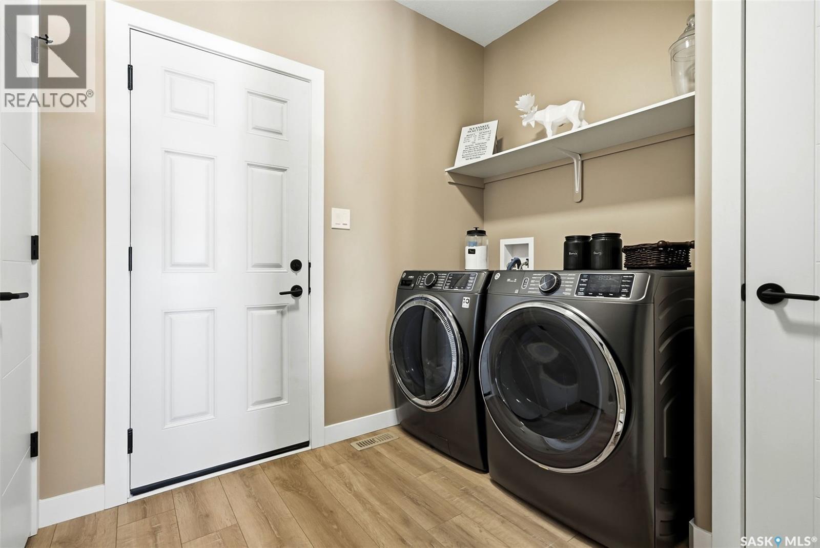 13 Plains Green, Pilot Butte, SK - Indoor Photo Showing Laundry Room