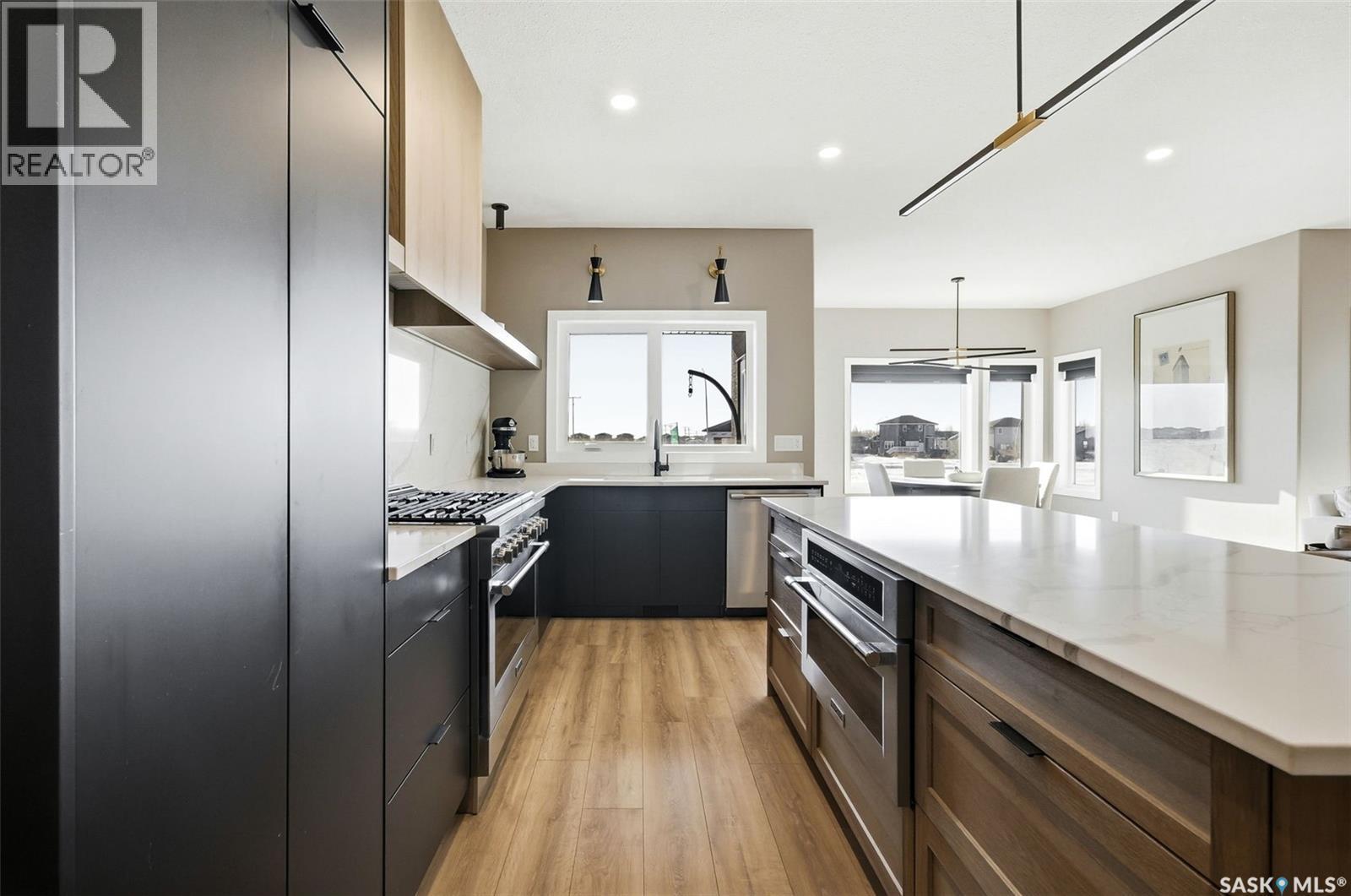 13 Plains Green, Pilot Butte, SK - Indoor Photo Showing Kitchen With Upgraded Kitchen