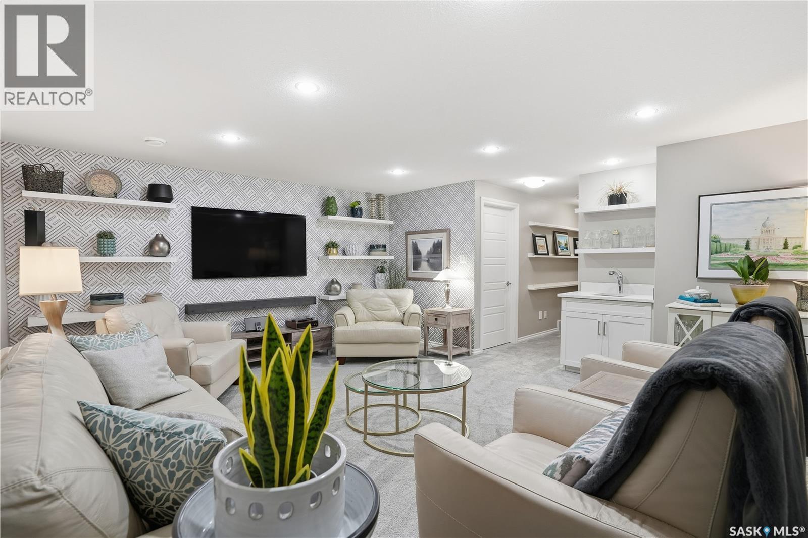 341 4000 Sandhill Crescent, Regina, SK - Indoor Photo Showing Living Room With Fireplace