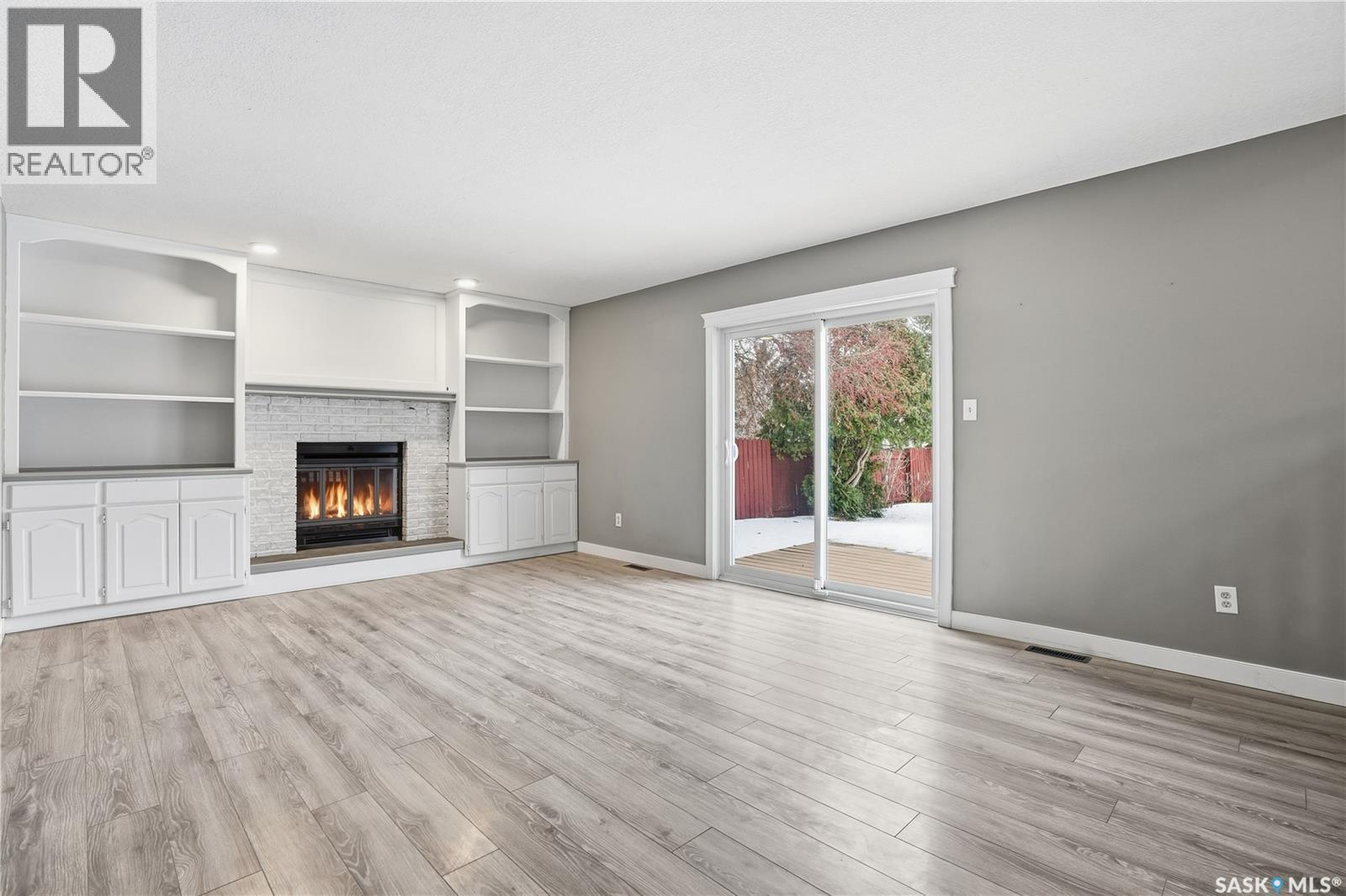 3418 Keohan Crescent, Regina, SK - Indoor Photo Showing Other Room With Fireplace