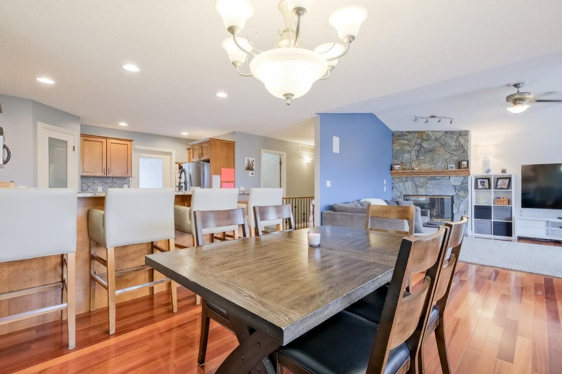 1410 Kendra Court, Kelowna, BC - Indoor Photo Showing Dining Room With Fireplace