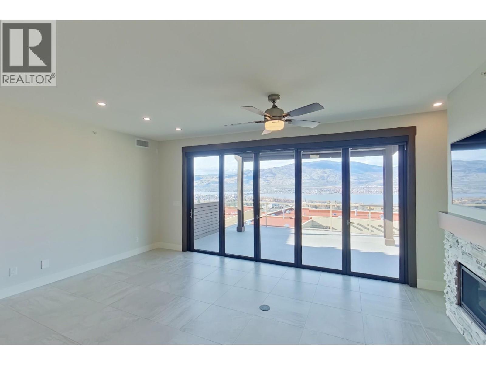 2000 Valleyview Drive Unit# 33, Osoyoos, BC - Indoor Photo Showing Other Room With Fireplace