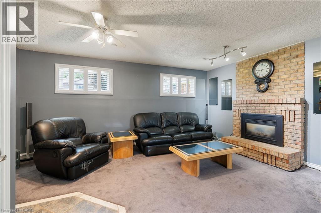 25 Burke Drive, Caledonia, ON - Indoor Photo Showing Living Room With Fireplace