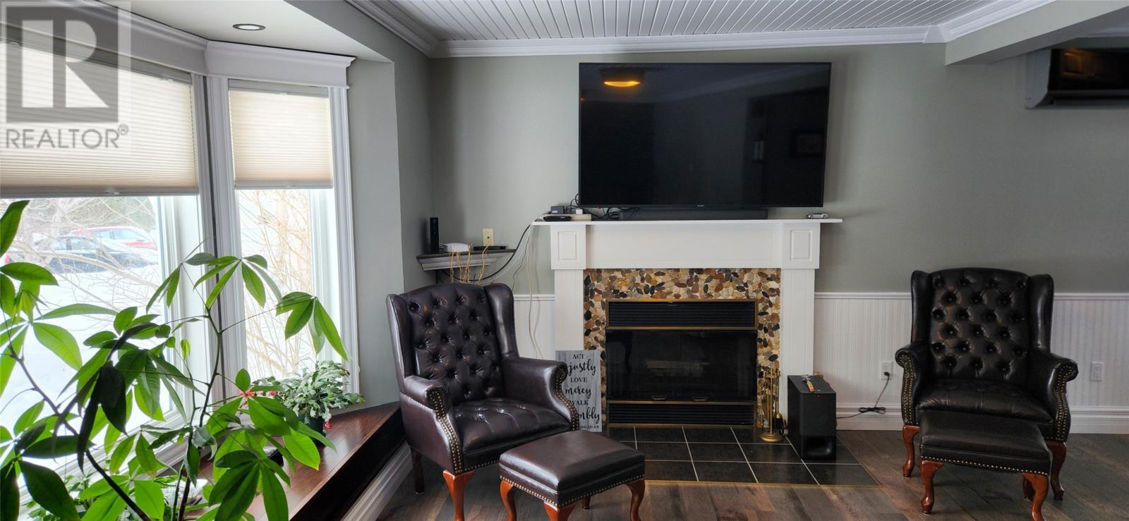 Wood burning fireplace - 15 Squires Road, Eastport, NL - Indoor With Fireplace