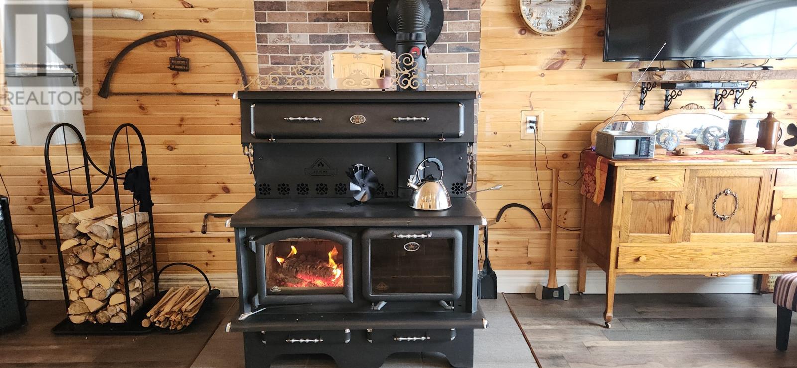 Cosy heat on cold winter nights - 15 Squires Road, Eastport, NL - Indoor Photo Showing Other Room