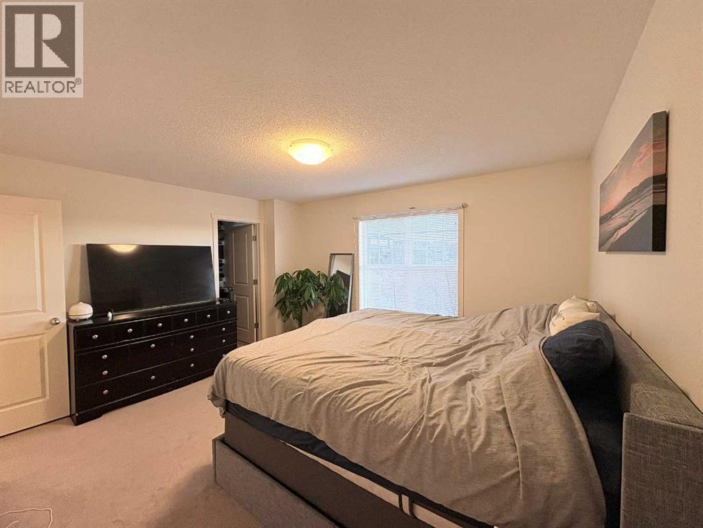 36 Evansborough Common Nw, Calgary, AB - Indoor Photo Showing Bedroom