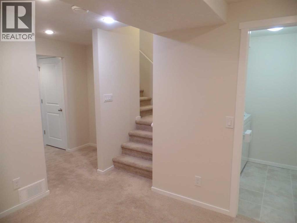 36 Evansborough Common Nw, Calgary, AB - Indoor Photo Showing Other Room