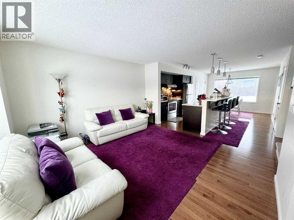 36 Evansborough Common Nw, Calgary, AB - Indoor Photo Showing Living Room