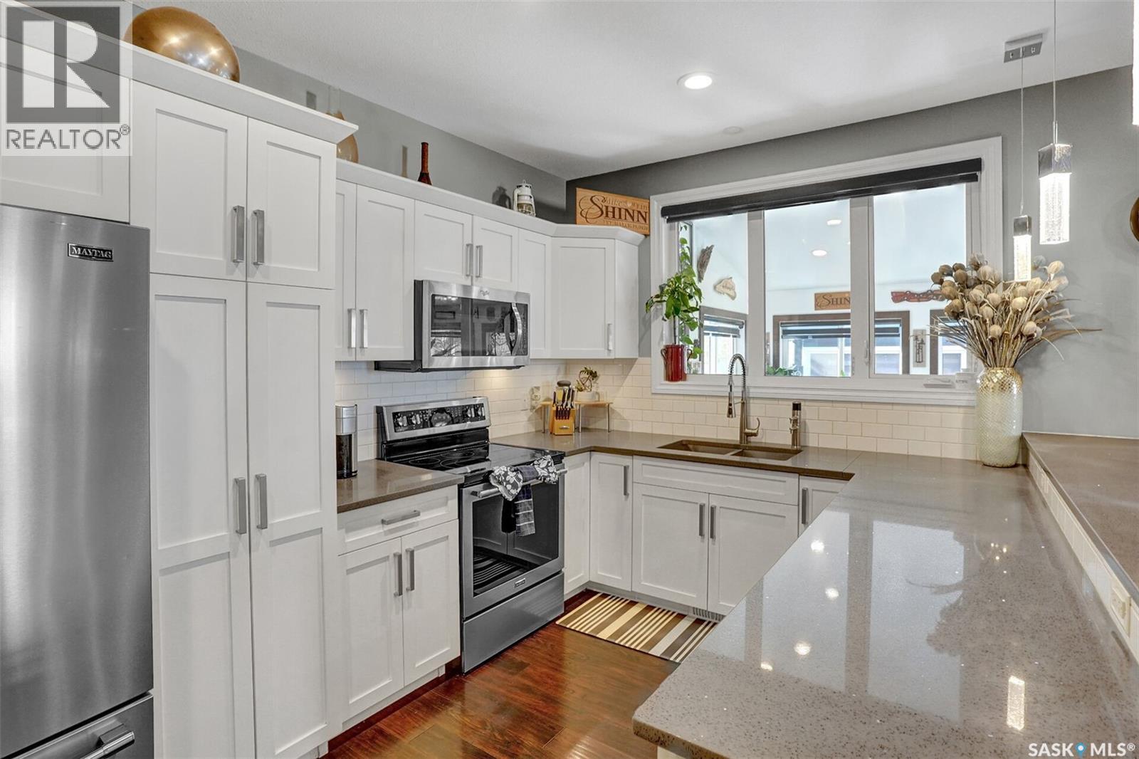 25 Hudson Drive, Pilot Butte, SK - Indoor Photo Showing Kitchen With Double Sink With Upgraded Kitchen