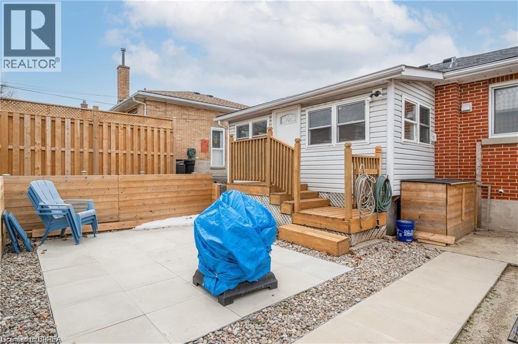 View of patio / terrace with a wooden deck - 426 Highland Road E Unit# A, Kitchener, ON - Outdoor With Deck Patio Veranda With Exterior