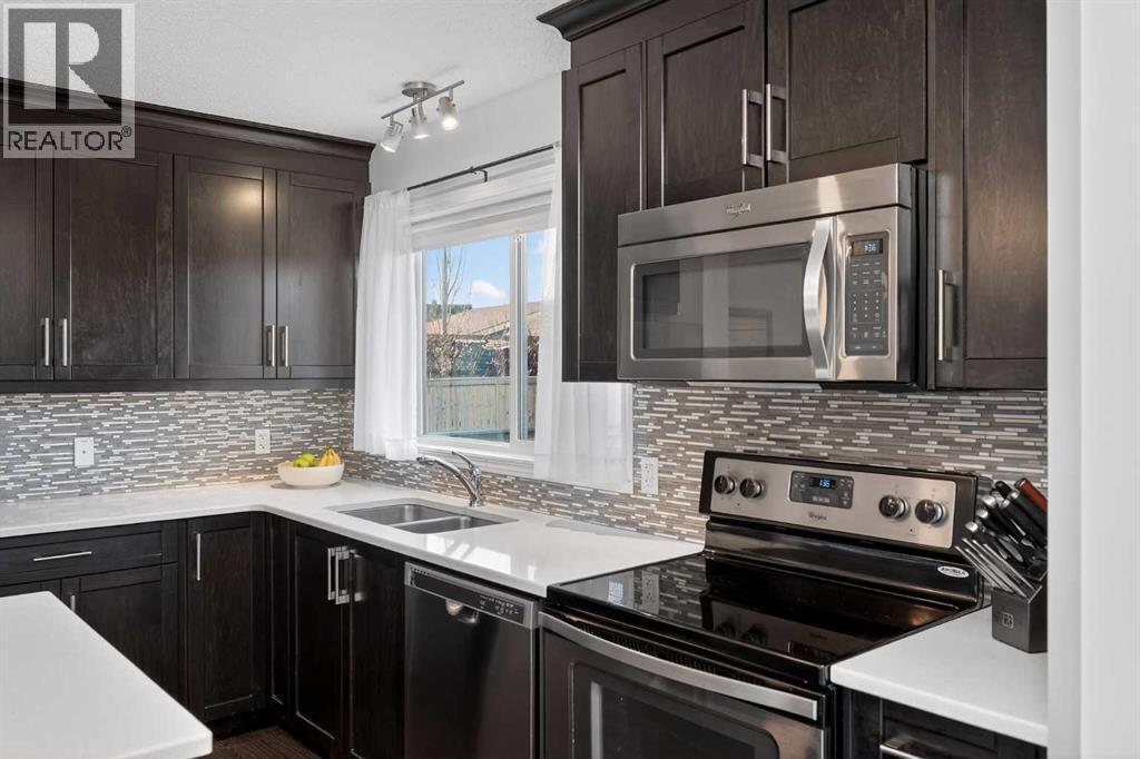 61 Auburn Meadows View Se, Calgary, AB - Indoor Photo Showing Kitchen With Stainless Steel Kitchen With Double Sink With Upgraded Kitchen