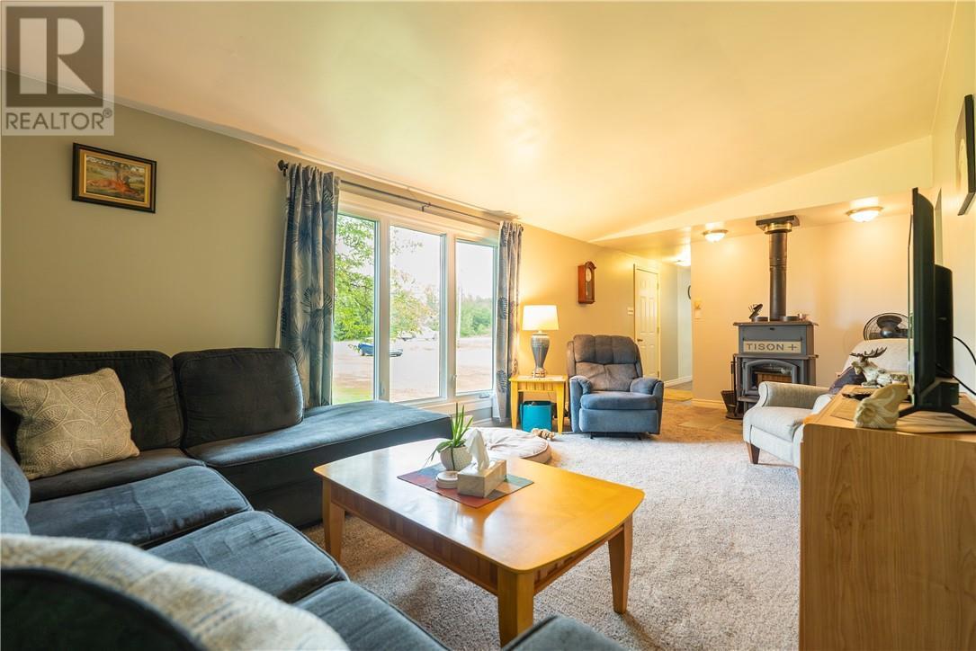 62 Highway 17 E, Spanish, ON - Indoor Photo Showing Living Room With Fireplace