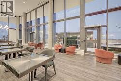 Lobby with a high ceiling and floor to ceiling windows -