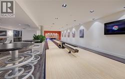 Game room with a bowling alley and recessed lighting -