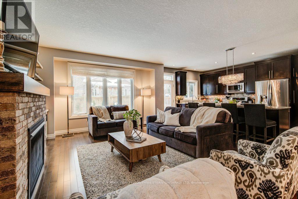 58 Eden Oak Trail, Kitchener, ON - Indoor Photo Showing Living Room With Fireplace
