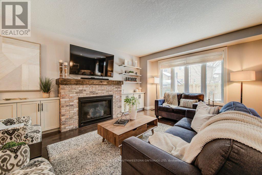 58 Eden Oak Trail, Kitchener, ON - Indoor Photo Showing Living Room With Fireplace