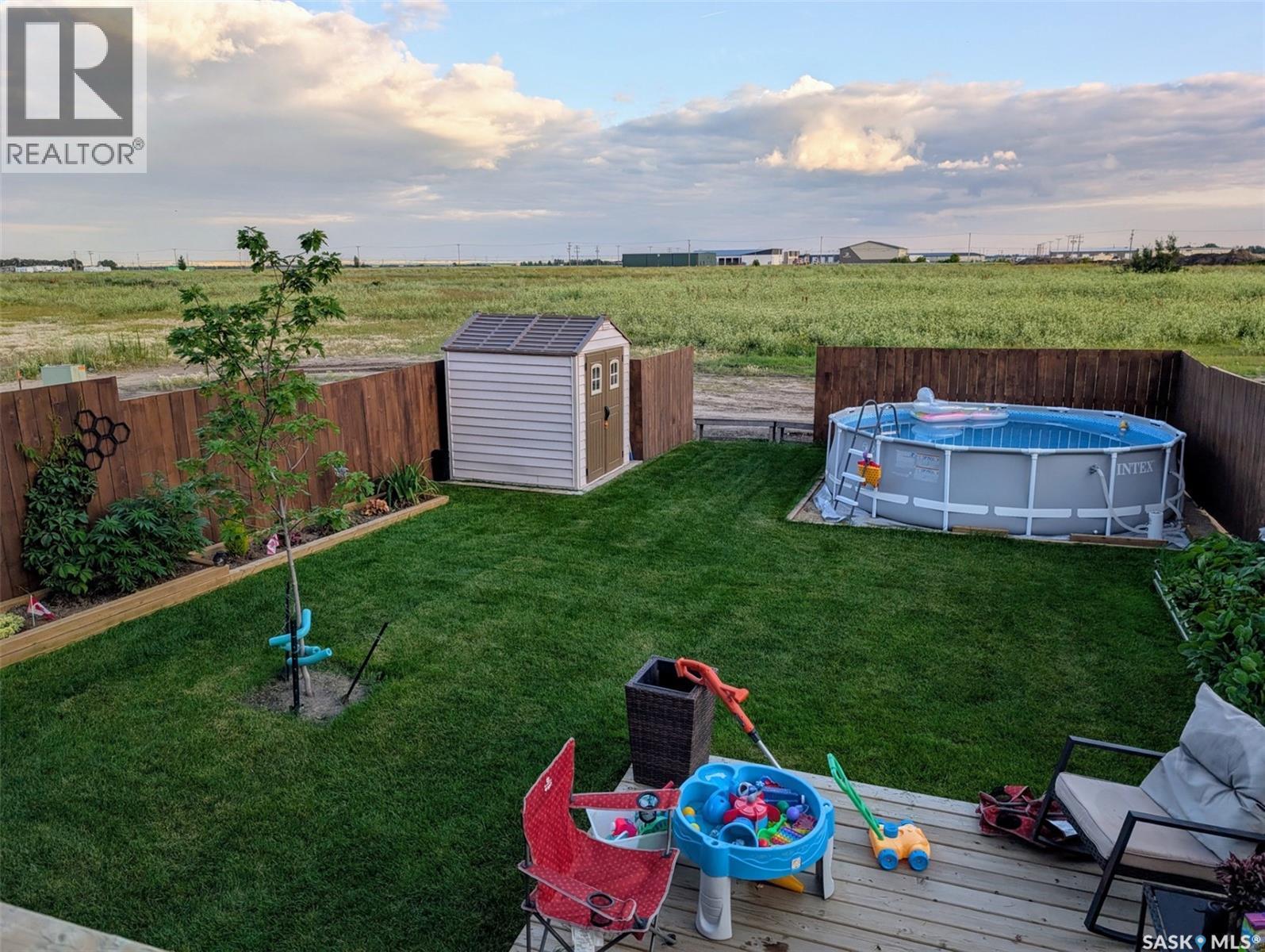 403 Eldorado Street, Warman, SK - Outdoor With Above Ground Pool