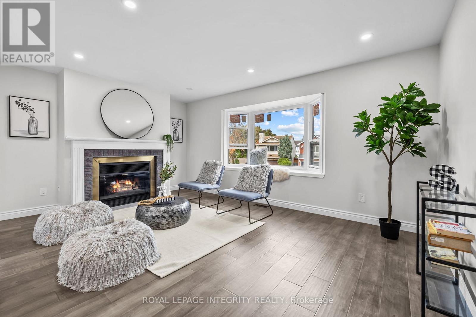 83 Saddle Crescent, Ottawa, ON - Indoor Photo Showing Living Room With Fireplace
