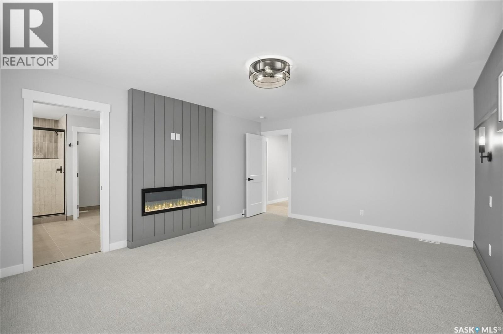 166 Cockroft Manor, Saskatoon, SK - Indoor Photo Showing Other Room With Fireplace