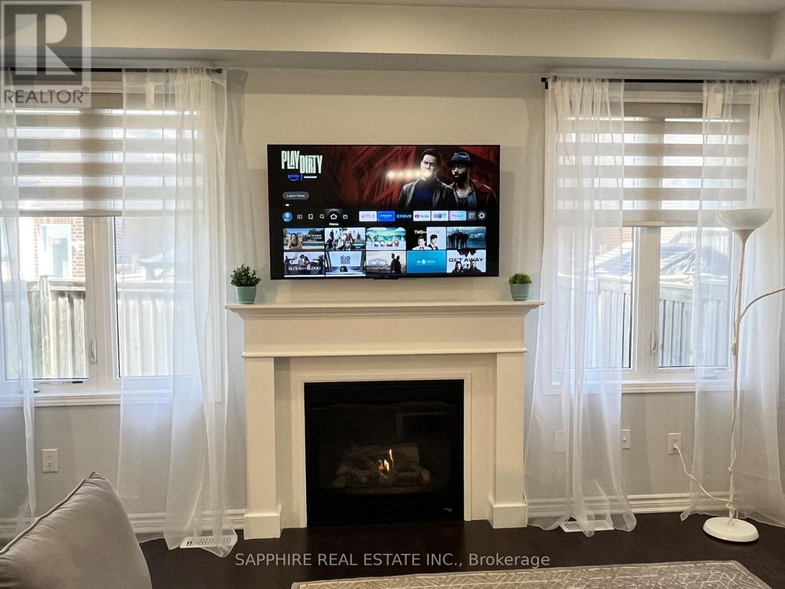 325 Trudeau Drive E, Milton, ON - Indoor Photo Showing Living Room With Fireplace