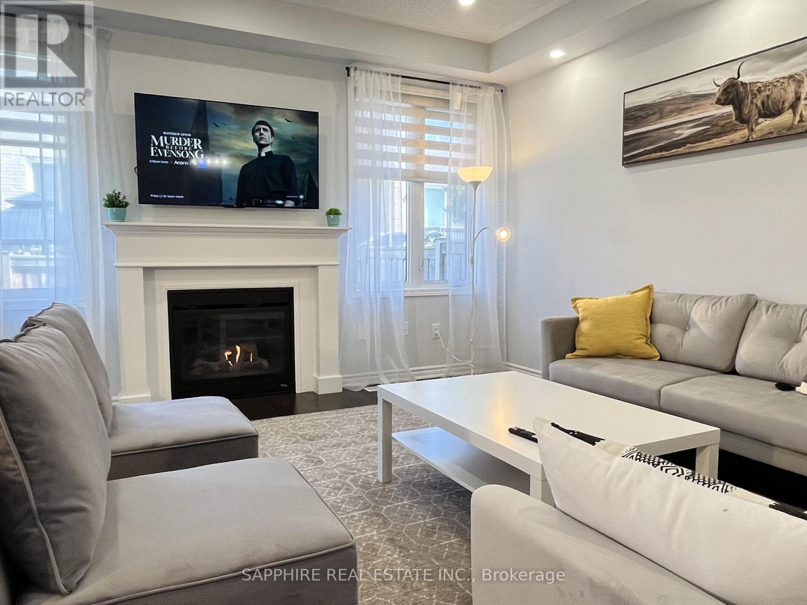 325 Trudeau Drive E, Milton, ON - Indoor Photo Showing Living Room With Fireplace