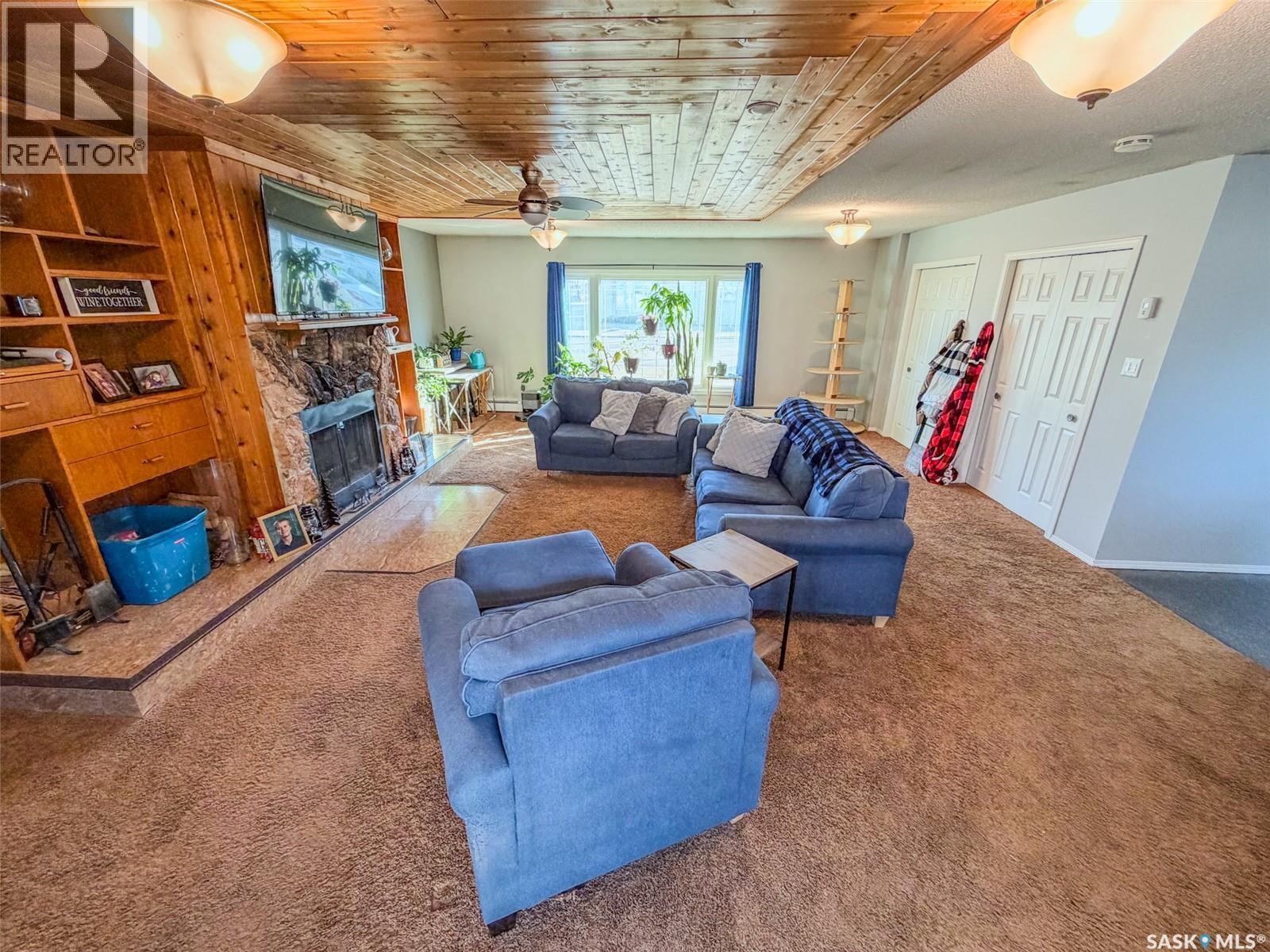 405 5Th Street E, Shaunavon, SK - Indoor Photo Showing Living Room With Fireplace