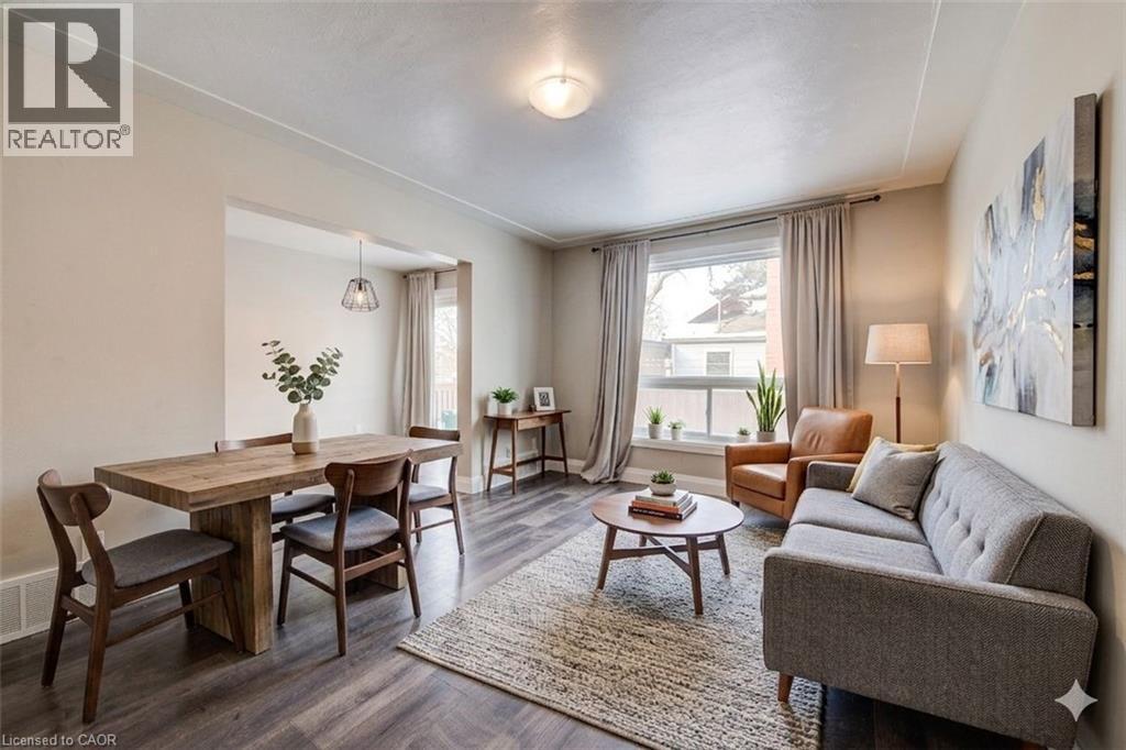 Living area with dark wood-type flooring and baseboards - 417 Garden Street, Cambridge, ON - Indoor Photo Showing Living Room