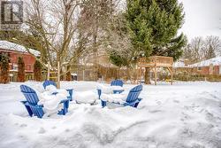 Seating area and tree fort in back yard -