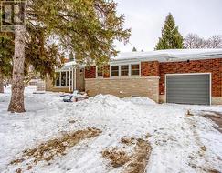 Front of house, garage, and driveway -