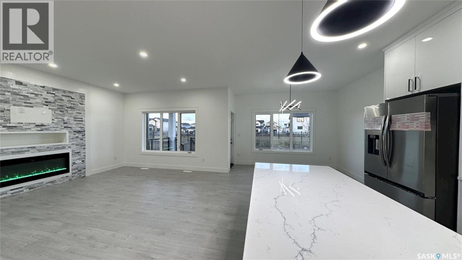 147 Woolf Bend, Saskatoon, SK - Indoor With Fireplace