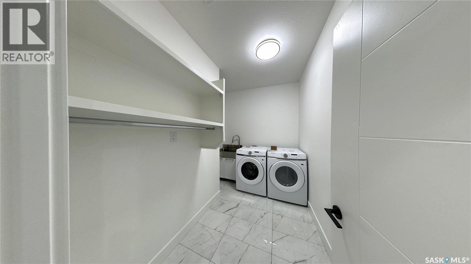 147 Woolf Bend, Saskatoon, SK - Indoor Photo Showing Laundry Room