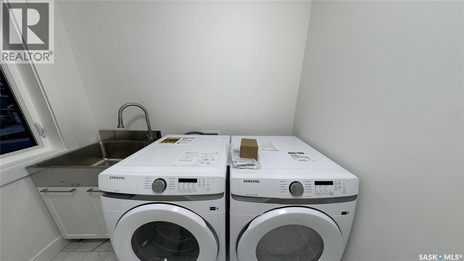 147 Woolf Bend, Saskatoon, SK - Indoor Photo Showing Laundry Room