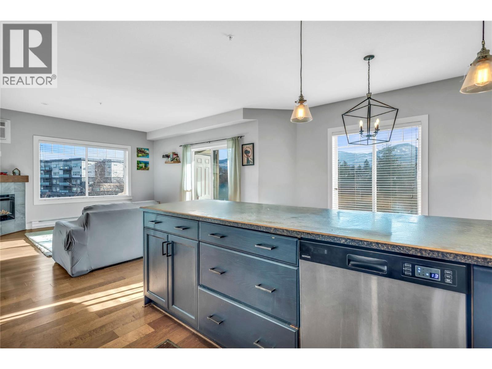 250 Hollywood Road S Unit# 302, Kelowna, BC - Indoor Photo Showing Kitchen With Fireplace