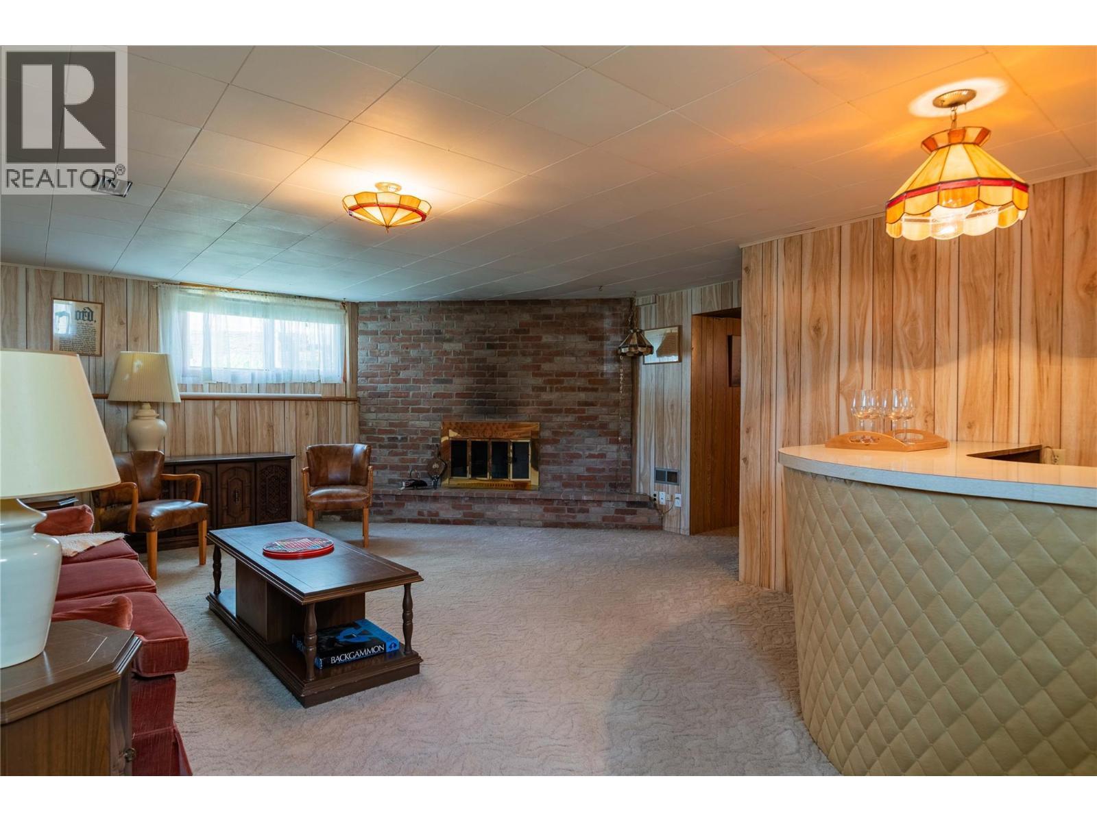 945 Thackeray Street, Warfield, BC - Indoor With Fireplace