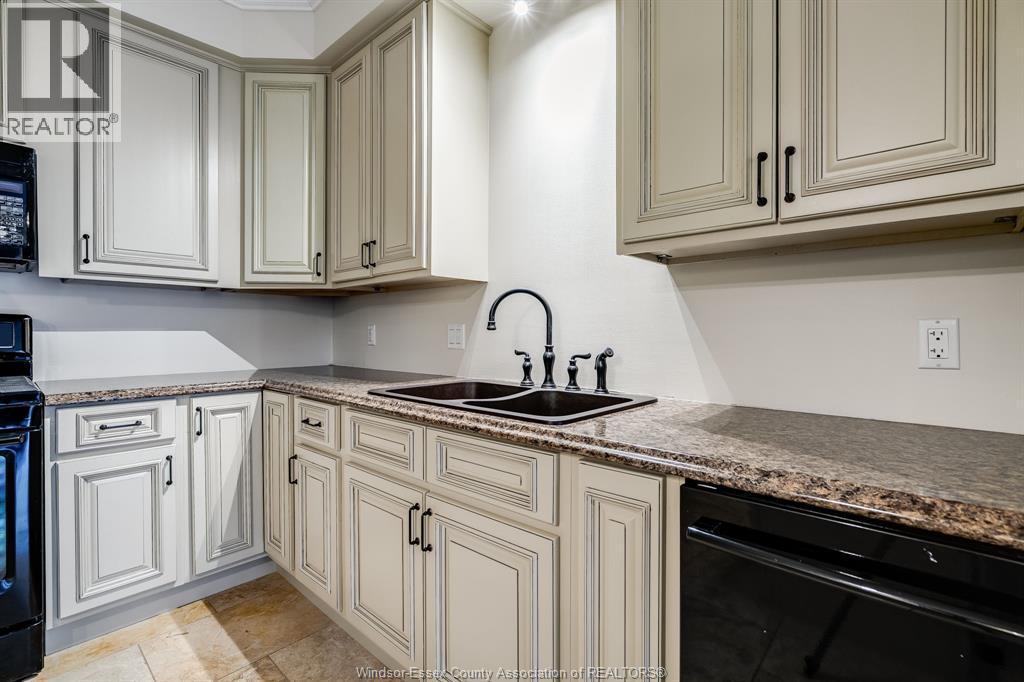 6 Two Creeks, Wheatley, ON - Indoor Photo Showing Kitchen With Double Sink