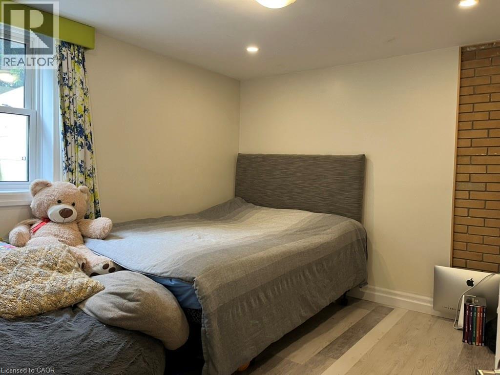 Bedroom featuring wood finished floors and recessed lighting - 235 Fearnwood Street, Cambridge, ON - Indoor Photo Showing Bedroom