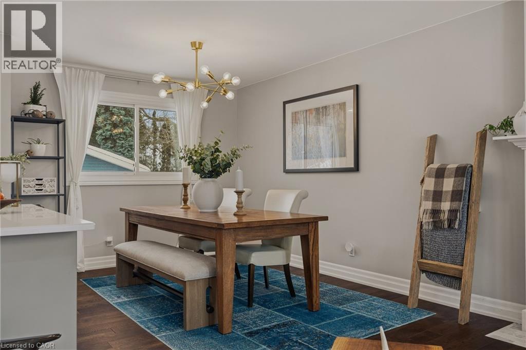 Kitchen features plenty of storage in island with lots of workspace, microwave is handy and yet nicely tucked away. - 2424 Eileen Drive, Burlington, ON