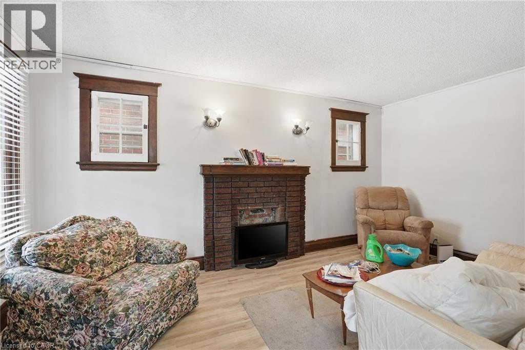 67 Sterling Street, Hamilton, ON - Indoor Photo Showing Living Room With Fireplace