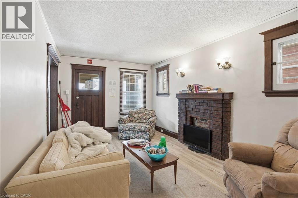 67 Sterling Street, Hamilton, ON - Indoor Photo Showing Living Room With Fireplace