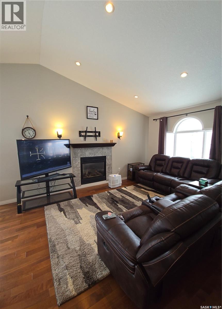 8 Main Bay, Muenster, SK - Indoor Photo Showing Living Room With Fireplace